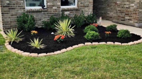 Landscape design and flower bed maintenance service for a commercial property in Beaumont.